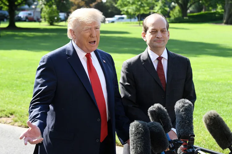 President Trump speaks to reporters alongside Labor Secretary Alex Acosta on the White House lawn